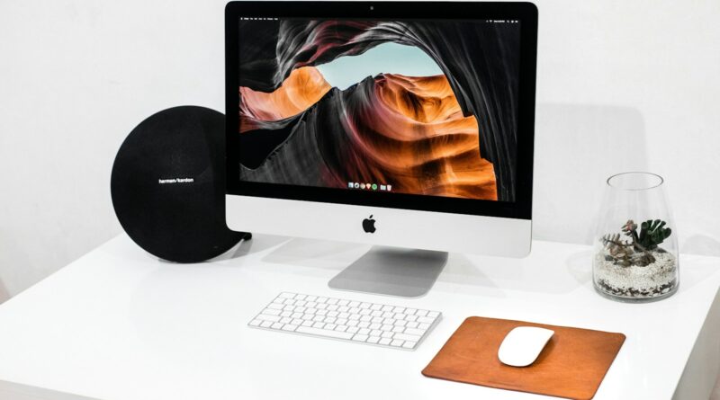 silver iMac with Apple Magic Keyboard and Magic Mouse